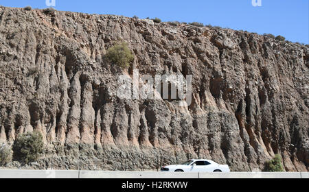 Oct 1, 2016, 2016. Palmdale CA, The San Andreas Fault is visible along the 14 freeway in Palmdale California Saturday. A swarm of earthquakes that rattled the Salton Sea area earlier this week has increased the probability of a major quake hitting Southern California.The California Office of Emergency Services (OES) issued an earthquake advisory warning residents and officials in Ventura, San Diego, San Bernardino, Riverside, Orange, Los Angeles, Kern and Imperial counties that there was a greater possibility of a major earthquake through Oct. 4.More than 140 seismic events have been rec Stock Photo