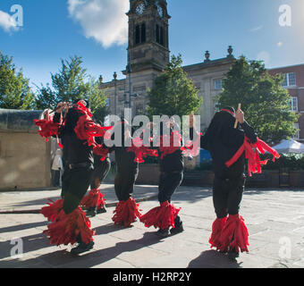 Derby City  Centre, UK. 2nd October 2016. Musicians and dancers are all around Derby Centre today, on the final day of the Derby Folk Festival. Seen here the 'Flag and bone gang' Morris dancers. Credit:  Simon Maycock/Alamy Live News Stock Photo