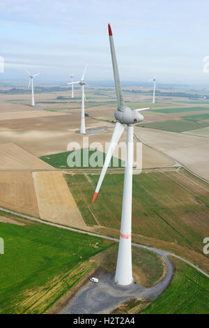 AERIAL VIEW. 198-meter-high Enercon E-126 wind turbines. Estinnes, Province of Hainaut, Wallonia, Belgium. Stock Photo