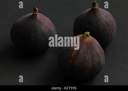 Fresh figs isolated on black beautiful food background Stock Photo