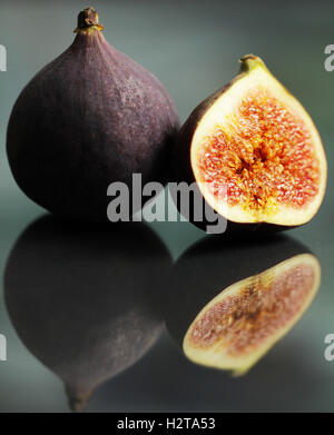 Fresh figs isolated on black beautiful food background Stock Photo