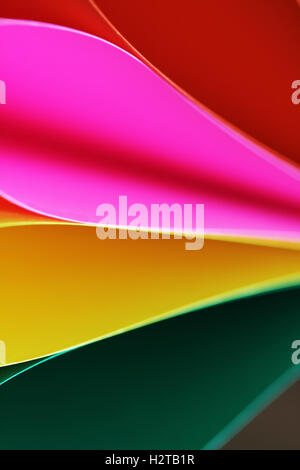 Abstract paper stack defocused colourful background. Paper stack of different colors defocused Stock Photo