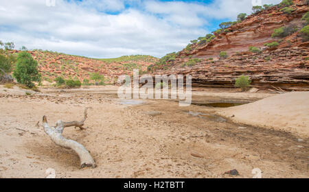The Murchison River gorge during a drought with tumblagooda sandstone bluffs under a cloudy sky in Kalbarri, Western Australia Stock Photo