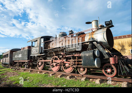 Rusted old steam engine of an old-fashioned locomotive train, originally used in the sugar industry, in Trinidad, Cuba Stock Photo
