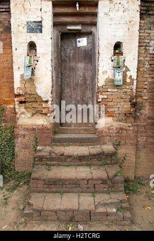 Indonesia, Bali, Tengannan, Bali Aga village, niches for offerings in house compound doorway Stock Photo