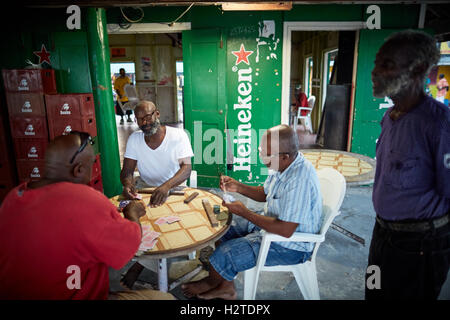 Barbados Oistins chef cook cooking   coastal town parish Christ Church fishing village tourists hang out Friday night Market baz Stock Photo