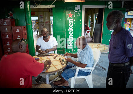 Barbados Oistins chef cook cooking   coastal town parish Christ Church fishing village tourists hang out Friday night Market baz Stock Photo