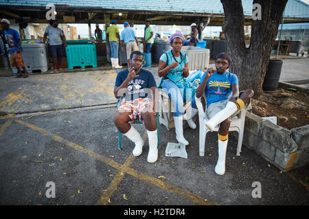 Barbados Oistins chef cook cooking   coastal town parish Christ Church fishing village small shop in the market space local work Stock Photo