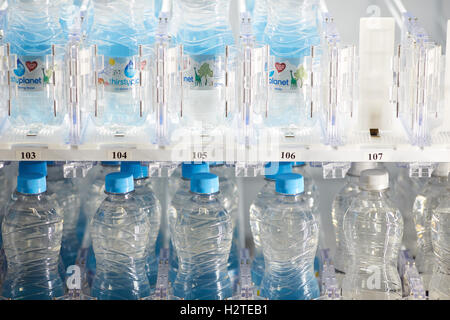Water bottles in cash vending machine Stock Photo