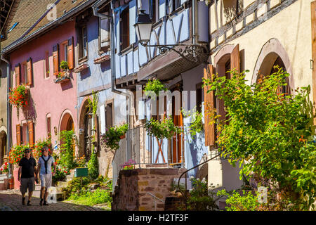 Colourful half-timbered traditional house in Eguisheim wine route village, Alsace, France Stock Photo