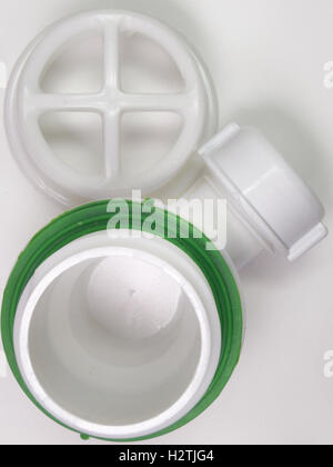 Plastic strainer for drain for hole of the sink. A fragment of the drain system Stock Photo