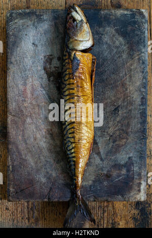 Smoked mackerel on the wooden board Stock Photo