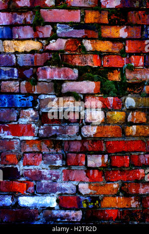 Colorful old bricks on wall that is falling apart Stock Photo