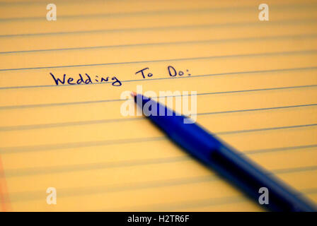 Wedding to do list written on paper with blue pen Stock Photo