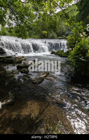 The River Wye dropping over Monsal Dale Weir, in the Peak District, Derbyshire Stock Photo