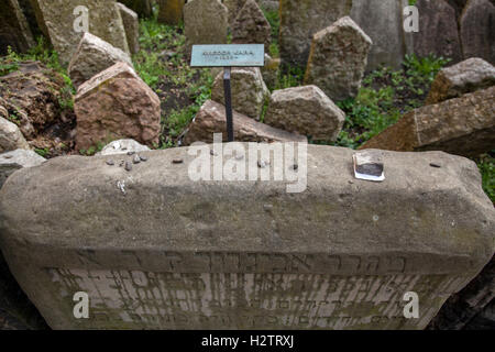 Old Jewish Cemetery Prague. Sometimes visitors leave pebbles or prayers written on small pieces of paper on the tombstones. Stock Photo