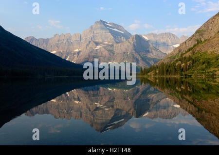 Mount Gould and Lake Josephine reflection of rocky mountain landscape in Glacier National Park Montana Stock Photo