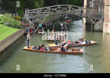 6th July 2016, Students, visitors and tourists in punts on the river Cam in Cambridge near the Mathematical bridge. Stock Photo