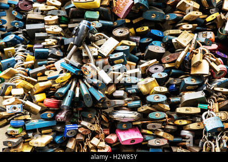 Symbolic many locks of love. Valentine's Day. Symbol of lovers. Padlocks scene. Stock Photo