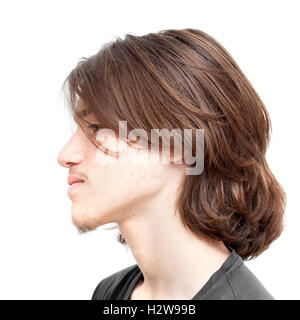 teenage boy with long  dark hair isolated on white background Stock Photo