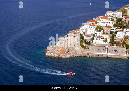 A sea taxi is just entering the port of Hydra island, in Argosaronic Gulf, near Athens, Greece. Stock Photo