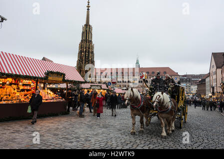 One of the main attractions during the Nuremberg Christmas Market festival is the horse-drawn stagecoach in Nuremberg, Bavaria, Germany.  One of the Stock Photo