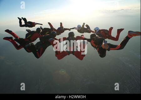 Skydiver number nine closing in on a star formation Stock Photo