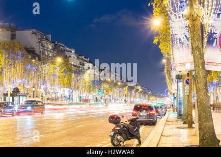 Paris; France-November 23, 2015 : The Christmas decoration on Champs Elysees avenue, blurred motion cars in Paris, France. Stock Photo