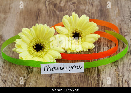 Thank you card with yellow gerbera daisies and colorful ribbon Stock Photo