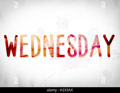 The word 'Wednesday' written in watercolor washes over a white paper background concept and theme. Stock Photo