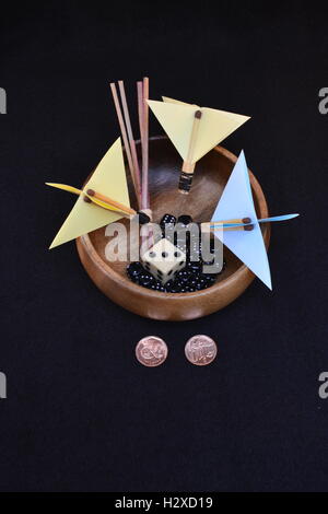 Random selection methods. Drawing straws. Flipping a coin. Throwing darts. Throwing dice. Stock Photo