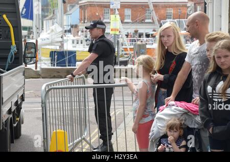 Harry Styles and Tom Hardy fans wait in Weymouth, Dorset as they are due to be filming the war movie Dunkirk. Weymouth harbour has period vehicles and boats for the WWII scenes. Many streets were closed and will remain closed tomorrow as filming continues Stock Photo
