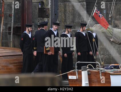 Harry Styles and Tom Hardy fans wait in Weymouth, Dorset as they are due to be filming the war movie Dunkirk. Weymouth harbour has period vehicles and boats for the WWII scenes. Many streets were closed and will remain closed tomorrow as filming continues Stock Photo