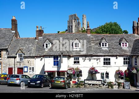 View of Corfe castle seen above The Greyhound Pub, Corfe, Dorset, England, UK, Western Europe. Stock Photo