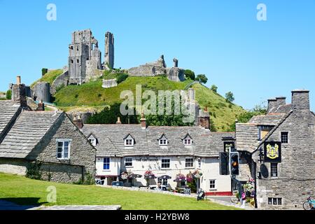 View of Corfe castle seen above The Greyhound Pub, Corfe, Dorset, England, UK, Western Europe. Stock Photo