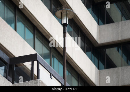 Architecture - street lamp in front of the facade of windows, metal and exposed aggregate concrete of St. Magnus house office building in London, UK Stock Photo