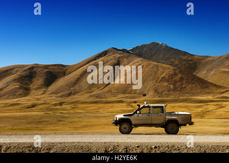 Car SUV on the mountains background Stock Photo