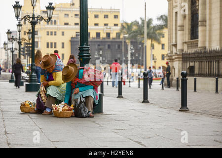 Peruvian Women Selling Sweets in the Streets of Lima, Peru. Stock Photo