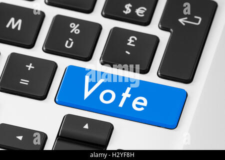 Vote button on keyboard for online electronic election Stock Photo