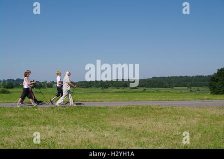 Young and old, Nordic Walking in the Allgaeu Stock Photo