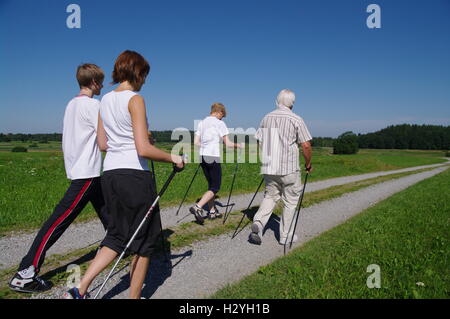 Young and old, Nordic Walking in the Allgaeu Stock Photo