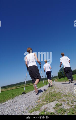 Young and old, Nordic Walking in the Allgaeu Stock Photo