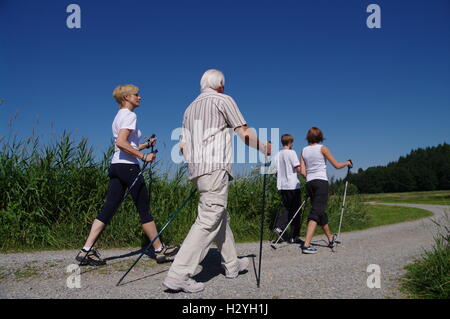 Young and old, Nordic Walking in the Allgaeu Stock Photo