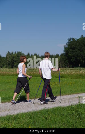 Young and old, Nordic Walking in the Allgaeu Stock Photo