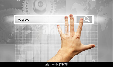 www written in search bar - male hand pressing Search button Stock Photo