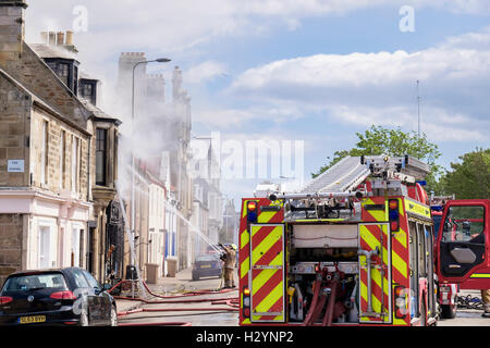 Scottish Fire and Rescue Service firefighters fighting a blazing shop building in Elie and Earlsferry Fife Scotland UK Britain Stock Photo