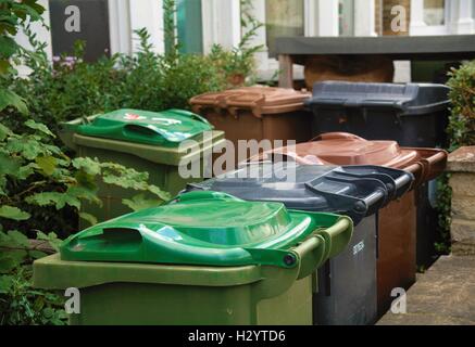 Plastic wheelie bins for general waste, recycling and garden waste in front of house in Waltham Forest , London England Stock Photo