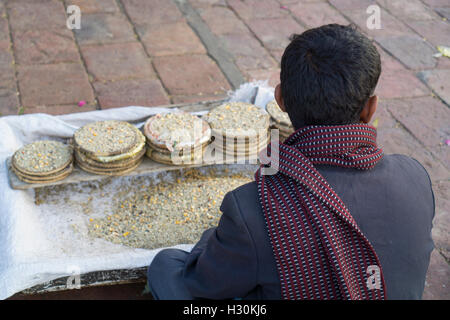 Paksitani man selling food on the street outside Shah Rukn e Alam Shrine Multan Pakistan Stock Photo