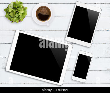 communicator device phone and tablet white color tone on wood table, mockup modern phone and digital tablet Stock Photo