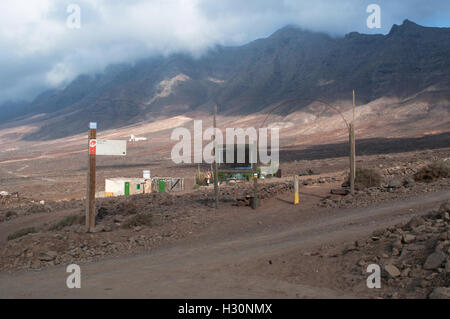 Fuerteventura, Canary Islands, North Africa, Spain: wooden signs to Morro Jable and the Pathway of Pajara in the village of Cofete Stock Photo